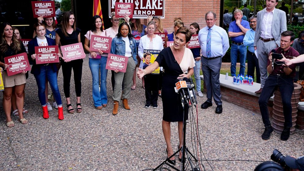 PHOTO: Kari Lake, Republican candidate for Arizona governor, answers a question at a news conference outside her campaign office in Phoenix, Ariz., Aug. 3, 2022.