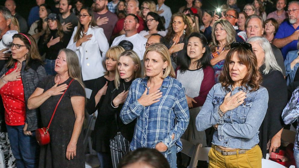 PHOTO: Supporters of Arizona GOP gubernatorial candidate Kari Lake say the pledge of allegiance before hearing her speak at a campaign appearance in Scottsdale, Ariz., Oct. 27, 2022.