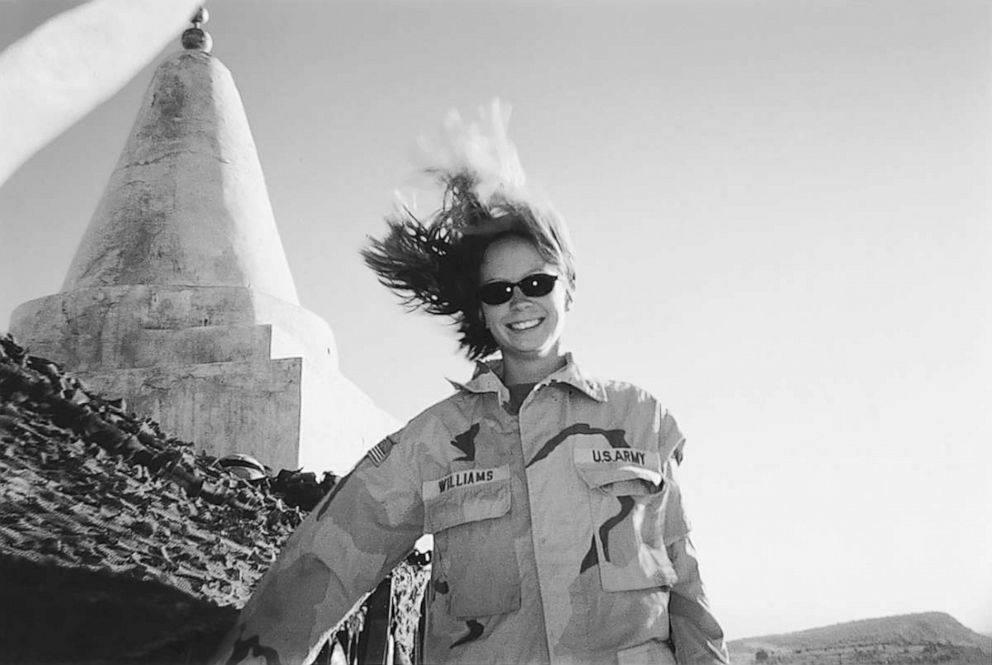 PHOTO: Kayla Williams in front of a Yezidi shrine on windy day on Sinjar Mountain, Iraq, in 2003.