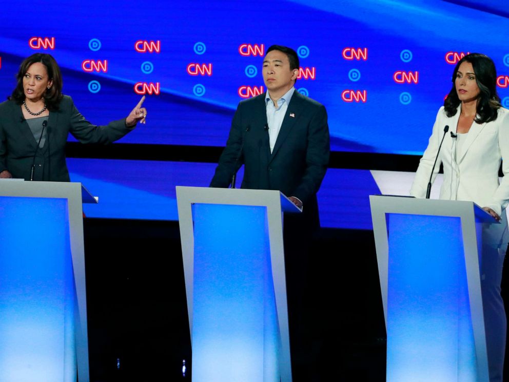 PHOTO: Senator Kamala Harris speaks as entrepreneur Andrew Yang and Rep. Tulsi Gabbard listen on the second night of the second presidential debate in Detroit, July 31, 2019.