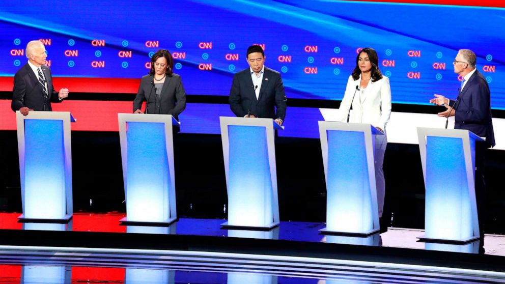 PHOTO:Governor Jay Inslee confronts former Vice President Joe Biden past Sen. Kamala Harris, entrepreneur Andrew Yang (C) and Rep. Tulsi Gabbard on the second night of the second 2020 Democratic presidential debate in Detroit, July 31, 2019. 