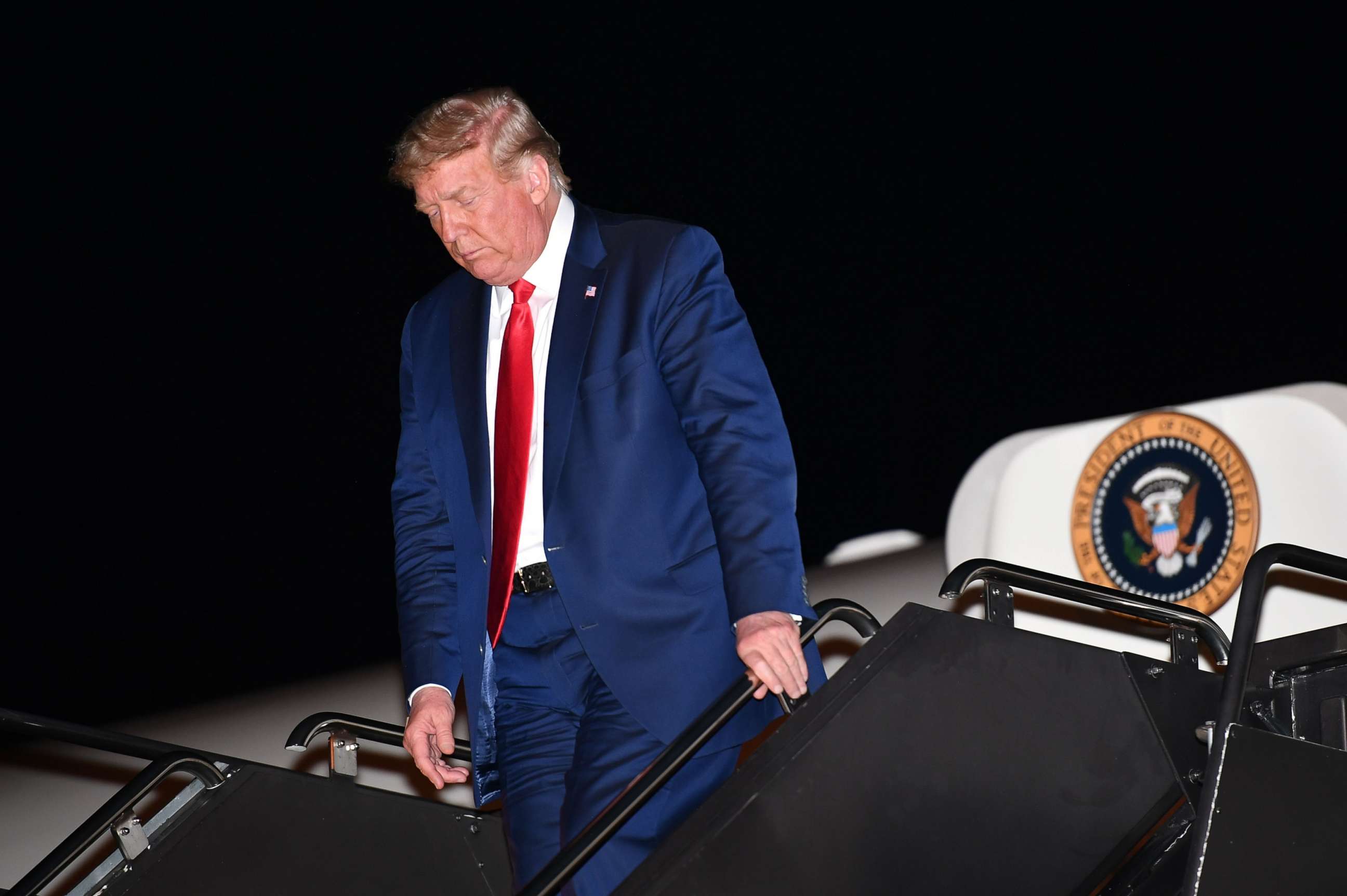 PHOTO: President Donald Trump steps off Air Force One upon arrival at McCarran International Airport in Las Vegas, Oct. 17, 2020.