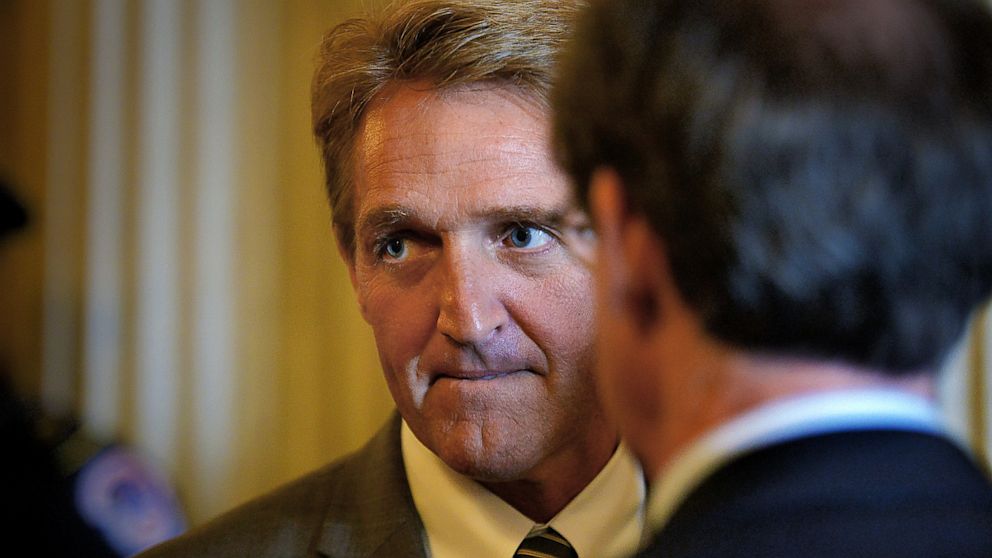 Senator Jeff Flake (R-Ariz.) ponders a reporters question outside of the Senate chamber after a vote on June, 13, 2013 in Washington, D.C.
