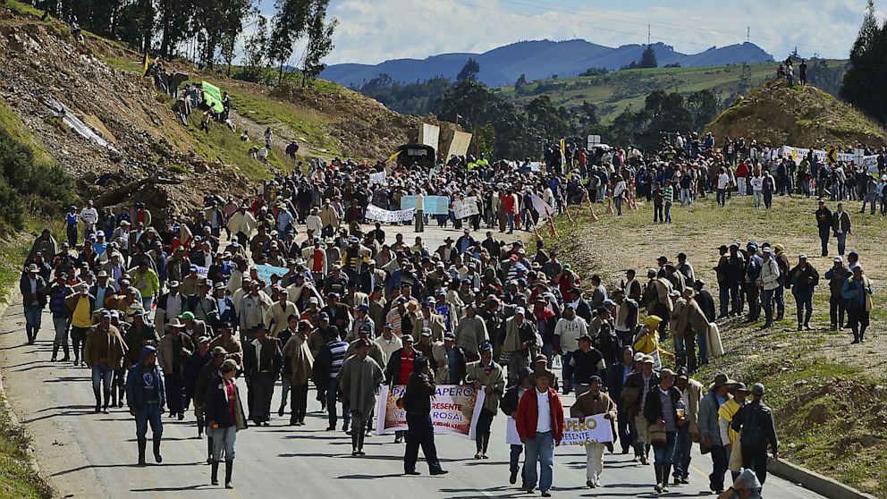 PHOTO: Colombian farmworkers demanding government subsidies and greater access to land march along the highway in Choconta, some 75km from Bogota, on August 22, 2013. 