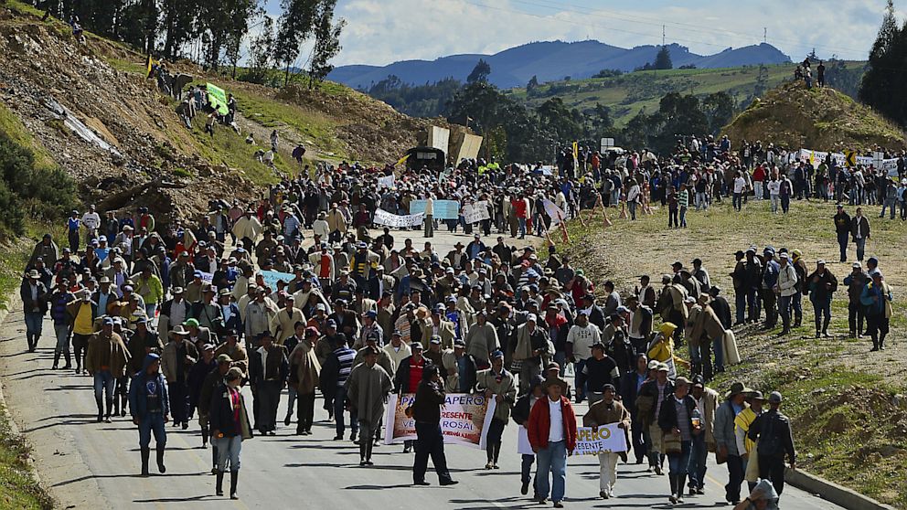 Colombian farmworkers demanding government subsidies and greater access to land march along the highway in Choconta, some 75km from Bogota, on August 22, 2013. Agrarian protests have been going on in Colombia for a week, with farmers staging roadblocks in at least 40 locations.  The protests have led to 98 arrests, and 5 deaths so far, with police reporting that 82 officers have been injured.

