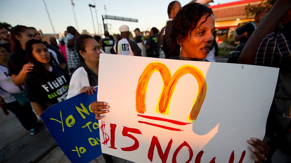 Fast food workers and their supporters picket outside a Burger King in Los Angeles on August 29, 2013.  