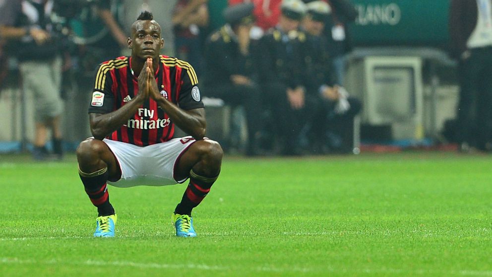 AC Milan's forwards Mario Balotelli reacts after missing a penalty shot during the Serie A football match AC Milan vs Naples, on September 22, 2013, at the San Siro stadium in Milan.  