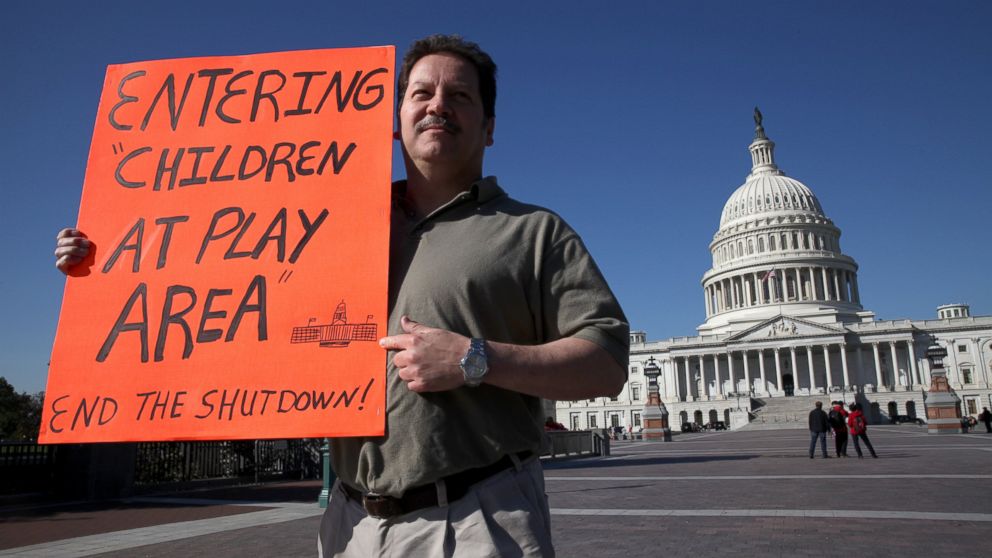 Matthew Murguia, a 53 year old furloughed federal employee, walks around the United States Capitol building on the fifteenth day of the U.S. government shutdown in Washington D.C., U.S., on Tuesday, Oct. 15, 2013. 