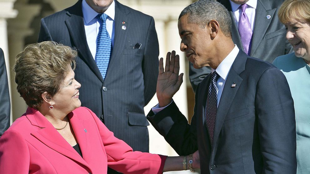 US President Barack Obama greets Brazils President Dilma Rousseff as they arrive for a photo opp at the G20 summit on Sept 6, 2013 in Saint Petersburg. After it's been revealed that the N.S.A. spied on Brazilian citizens and companies, the US government has not been able to appease President Rousseff.