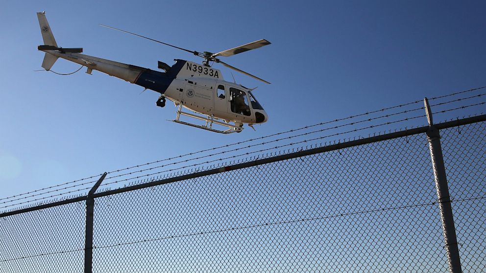 A U.S. Office of Air and Marine (OAM) helicopter patrols near the U.S.-Mexico border on October 1, 2013 in San Diego, California.  