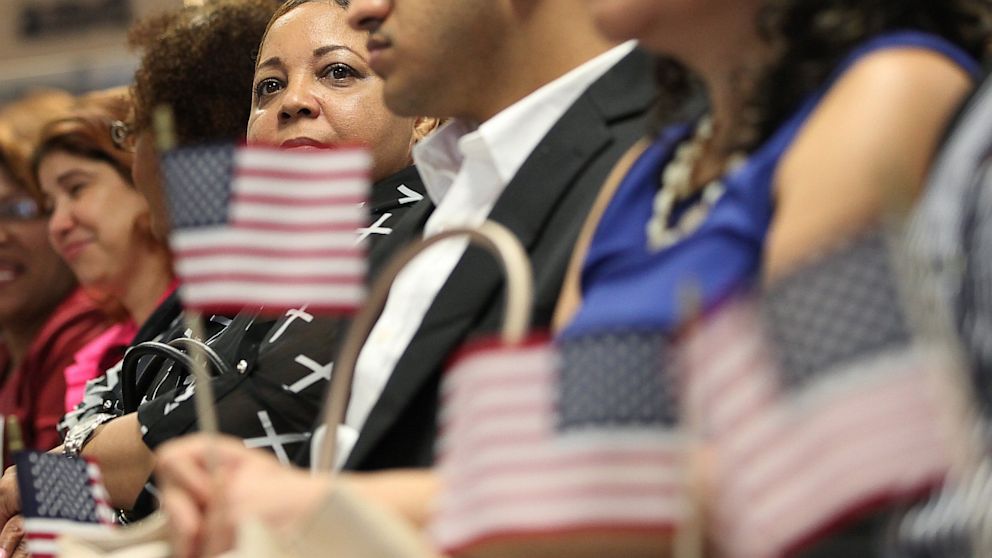 Citizenship candidates attend a naturalization ceremony for approximately 150 citizenship candidates at Federal Plaza in Manhattan on August 23, 2013 in New York City.