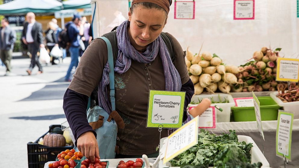 A woman shops for groceries in the GrowNYC Greenmarket in Union Square using  Electronic Benefits Transfer (EBT), more commonly known as Food Stamps,on September 18, 2013 in New York City.  