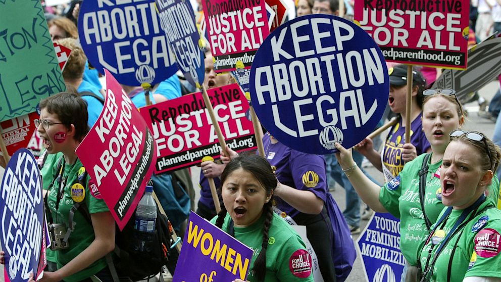 Pro-choice activists shout slogans as they take part in the March For Women's Lives April 25, 2004 in Washington, DC.   