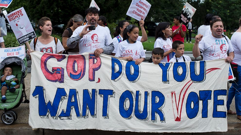 UNITED STATES - AUGUST 1: Immigration reform supporters protest in front of the Cannon House Office Building on Thursday, August 1, 2013. 