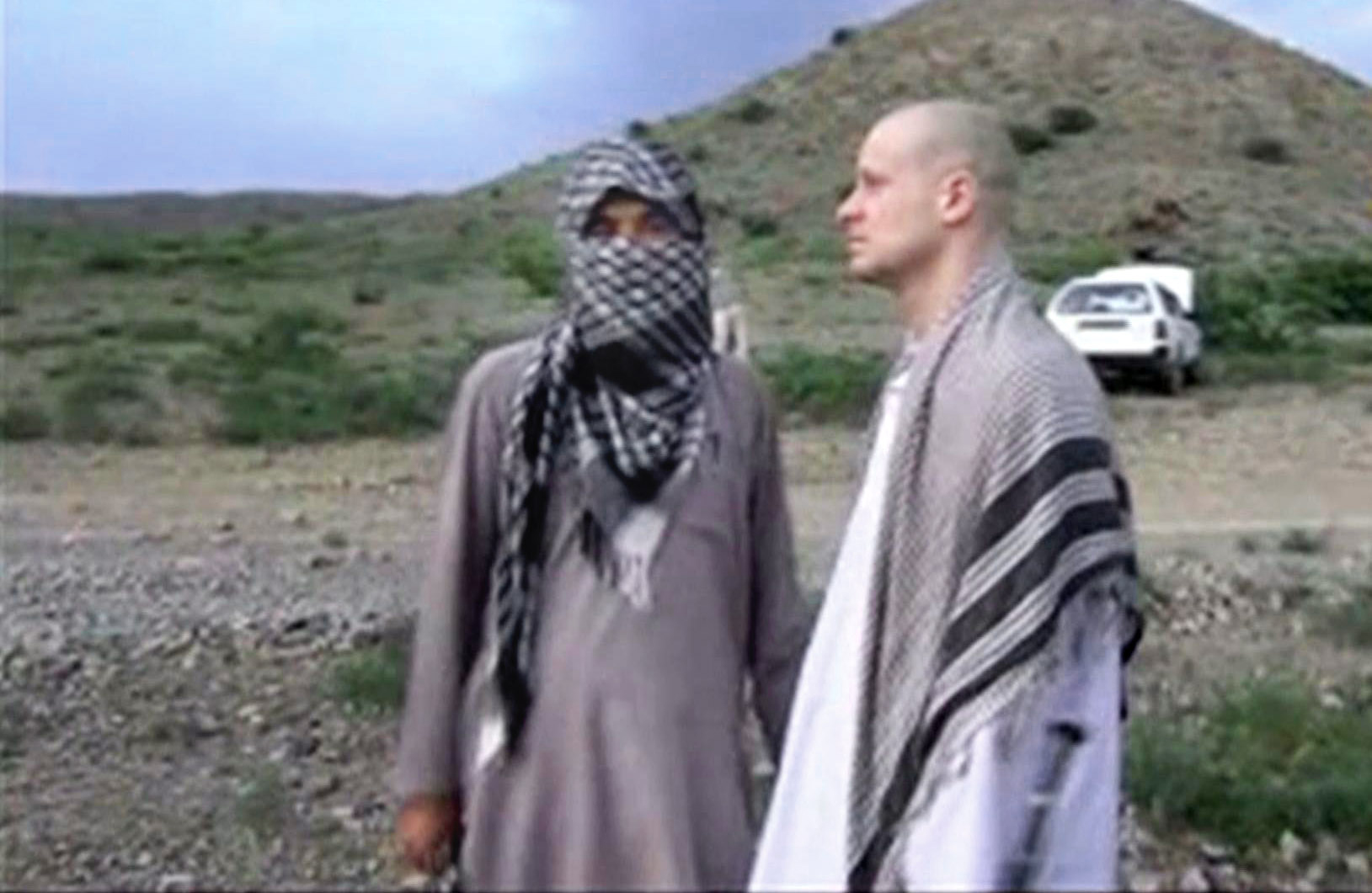 PHOTO: Sgt. Bowe Bergdahl, right, stands with a Taliban fighter in eastern Afghanistan, in this image taken from video obtained from Voice Of Jihad Website, which has been authenticated based on its contents and other AP reporting.