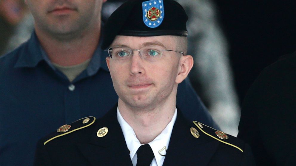 Army Pfc. Bradley Manning is escorted out of a courthouse in Fort Meade, Md., Tuesday, July 30, 2013, after receiving a verdict in his court martial.