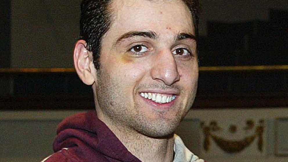 Tamerlan Tsarnaev smiles after accepting a trophy for winning the 2010 New England Golden Gloves Championship in Lowell, Mass., Feb. 17, 2010. 