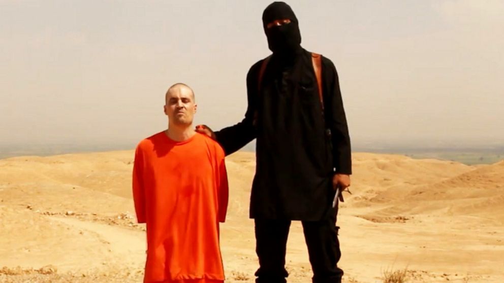 A screengrab from a video posted online appears to show American journalist James Foley shortly before he is killed by a masked captor.
