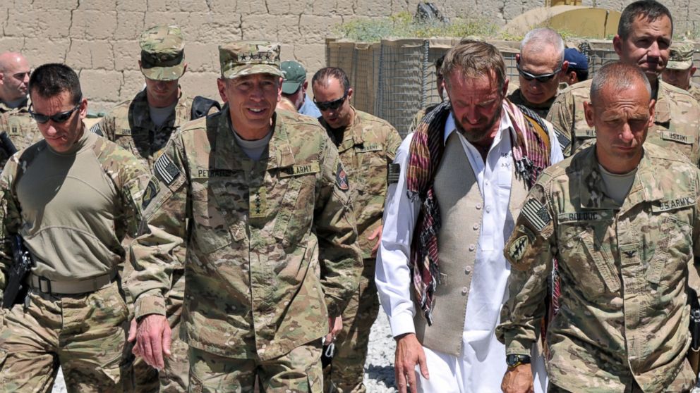 PHOTO: Gen. David Petraeus, seen here second from left next to former Special Forces Maj. Jim Gant, took over command of U.S. forces in Afghanistan in 2010. He has praised Gant's courage, intelligence and vision.