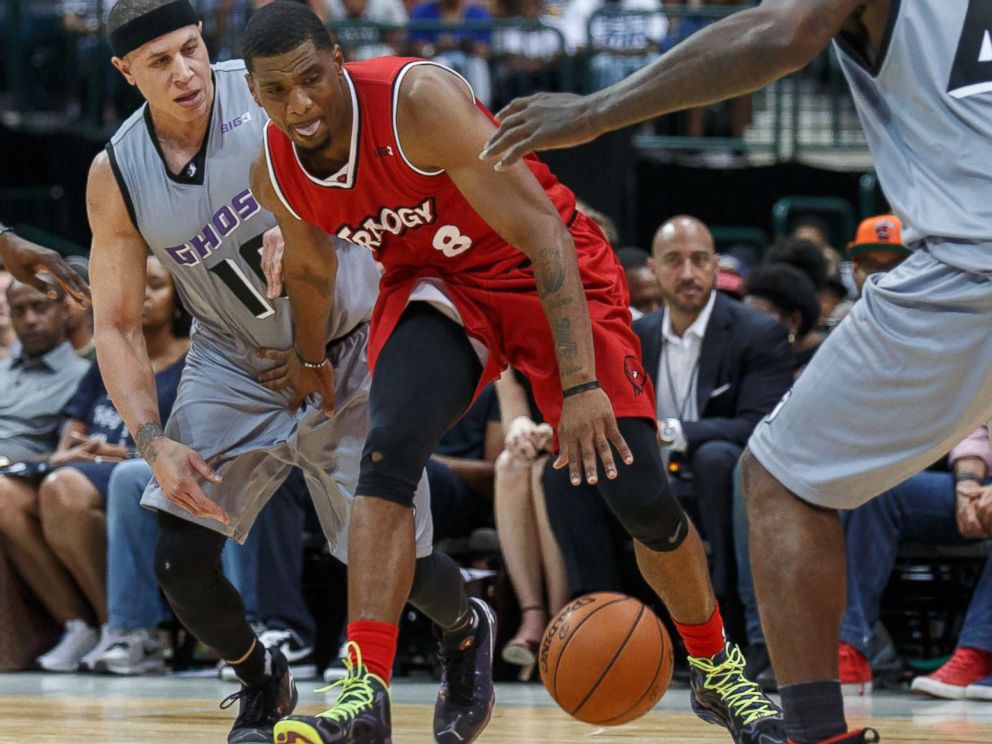 PHOTO: Trilogy guard James White dribbles as Ghost Ballers guard Mike Bibby and forward Ivan Johnson defend during the Big3 basketball game between the Ghost Ballers and Trilogy on July 30, 2017, at the American Airlines Center in Dallas, Texas.