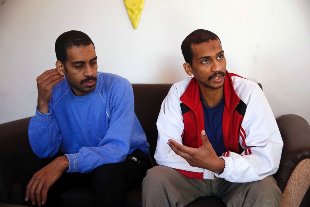 PHOTO: Alexanda Amon Kotey, left, and El Shafee Elsheikh, who were allegedly among four British jihadis who made up a brutal Islamic State cell dubbed "The Beatles," speak during an interview at a security center in Kobani, Syria, March 30, 2018.