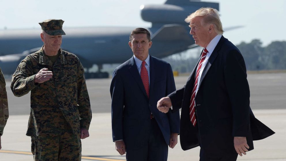PHOTO: President Donald Trump walks in front of National Security Adviser Michael Flynn and Joint Chiefs Chairman Gen. Joseph Dunford, left, and after arriving at MacDill Air Force Base in Tampa, Fla., Feb. 6, 2017. 