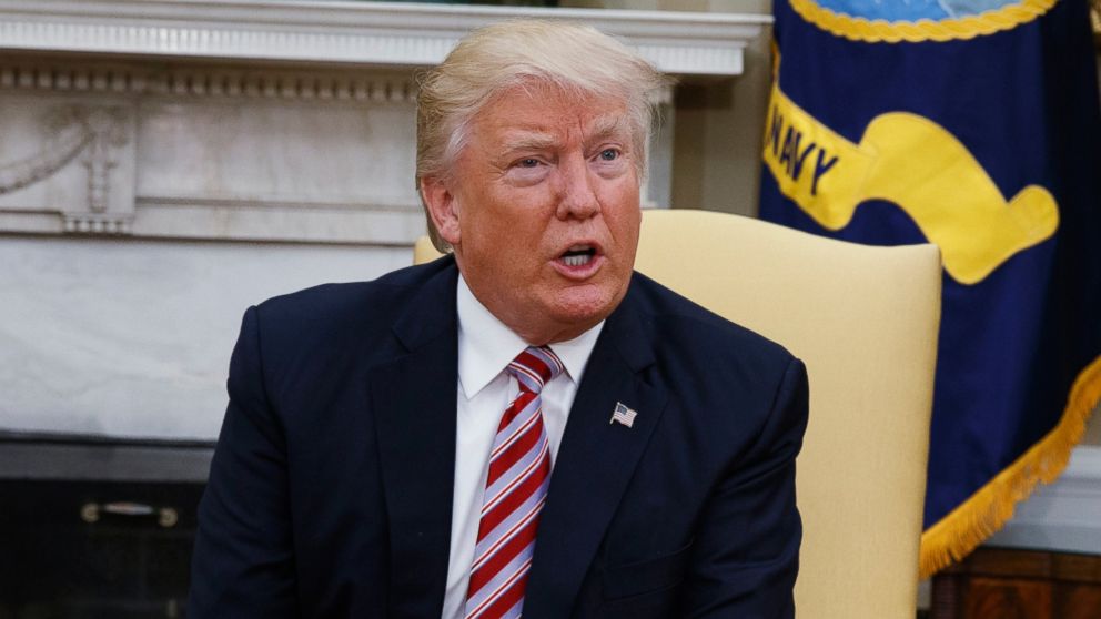 President Donald Trump talks to reporters in the Oval Office of the White House, May 10, 2017.