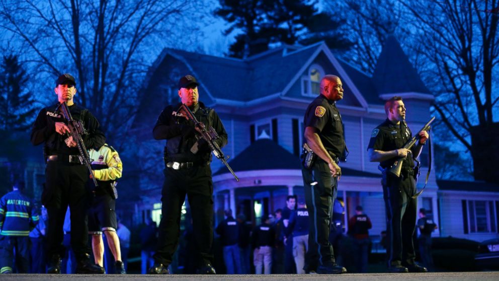 PHOTO: Police officers guard the entrance to Franklin street where there is an active crime scene search for the suspect in the Boston Marathon bombings,  April 19, 2013, in Watertown, Mass.