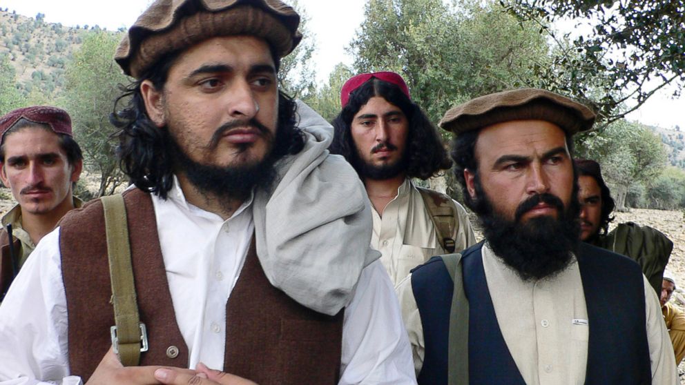Pakistani Taliban chief Hakimullah Mehsud, left, is seen with Waliur Rehman during his meeting with media in Sararogha, a Pakistani tribal area of South Waziristan along the Afghanistan border, Oct. 4, 2009.