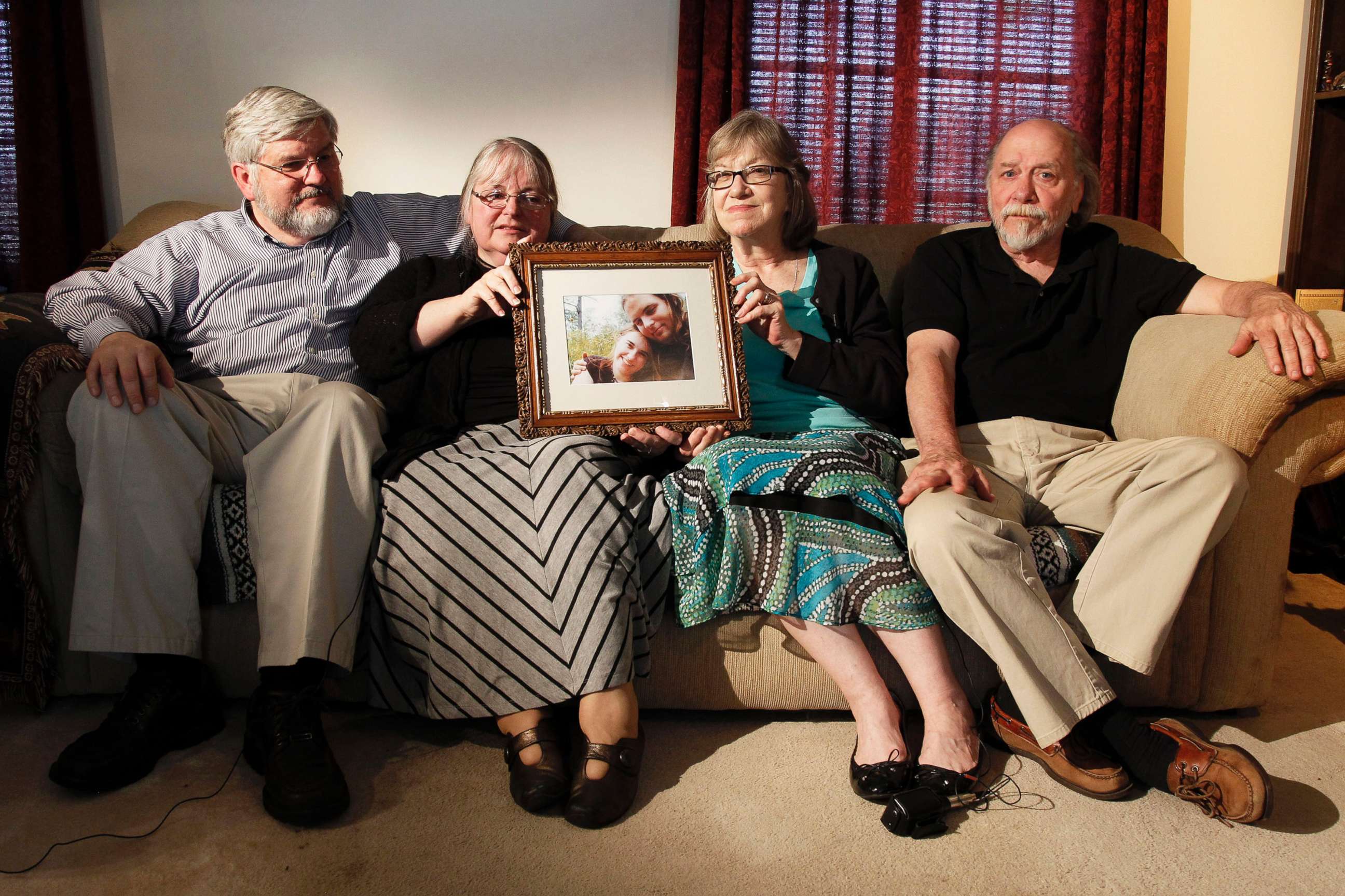 PHOTO: From left, Patrick Boyle, Linda Boyle, Lyn Coleman and Jim Coleman with a photo of their kidnapped children, Joshua Boyle and Caitlan Coleman, who were kidnapped by the Taliban in late 2012, June 4, 2014, in Stewartstown, Pa.  