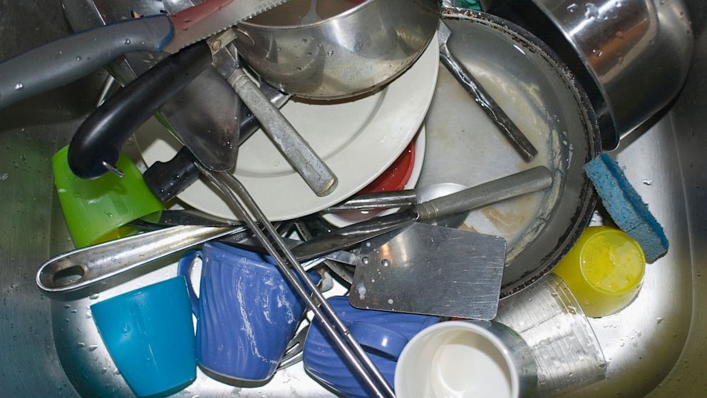 Dirty dishes fill the sink.