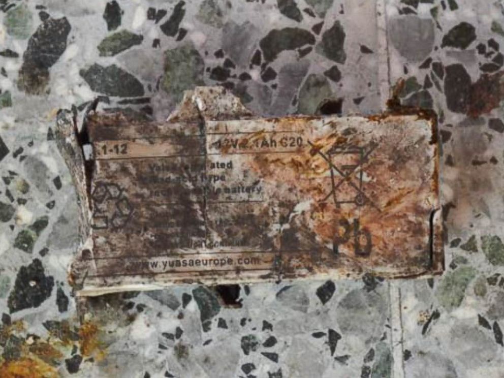 PHOTO: Authorities identified the remains of Yuasa 12-volt, 2.1 amp lead acid battery.