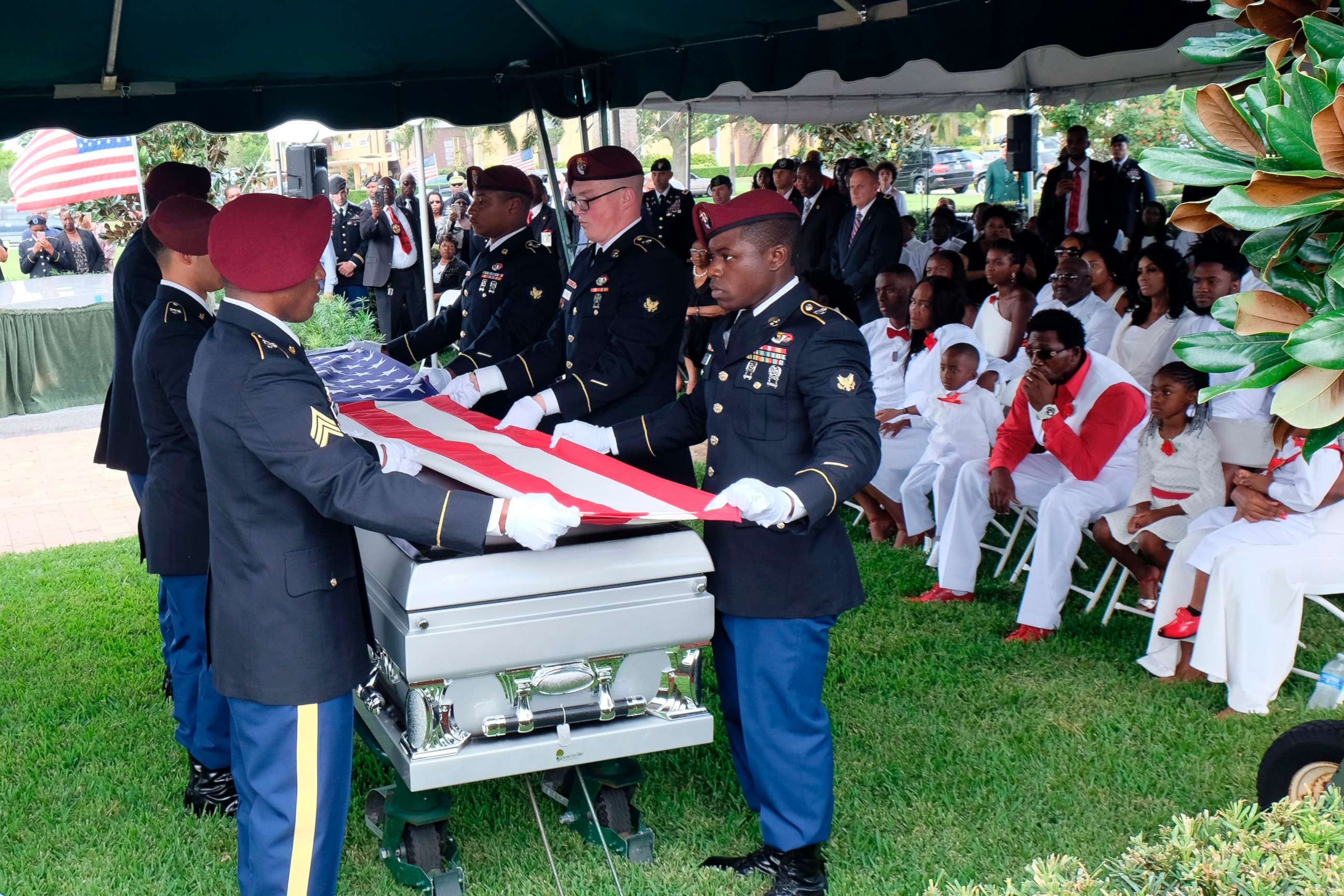 PHOTO: Members of the army honor guard fold the flag above the casket of US Army Sgt. La David Johnson during his burial service on October 21, 2017 in Hollywood, Florida. Johnson and three other US soldiers were killed in an ambush in Niger on October 4.