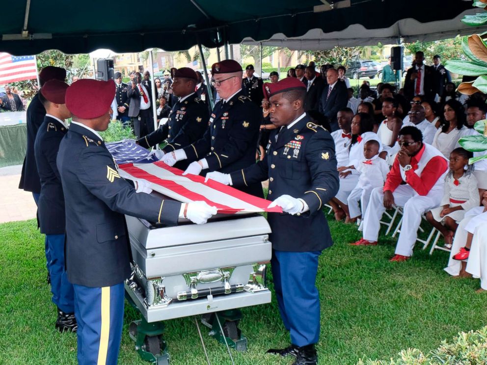 PHOTO: Members of the army honor guard fold the flag above the casket of US Army Sgt. La David Johnson during his burial service on October 21, 2017 in Hollywood, Florida. Johnson and three other US soldiers were killed in an ambush in Niger on October 4.