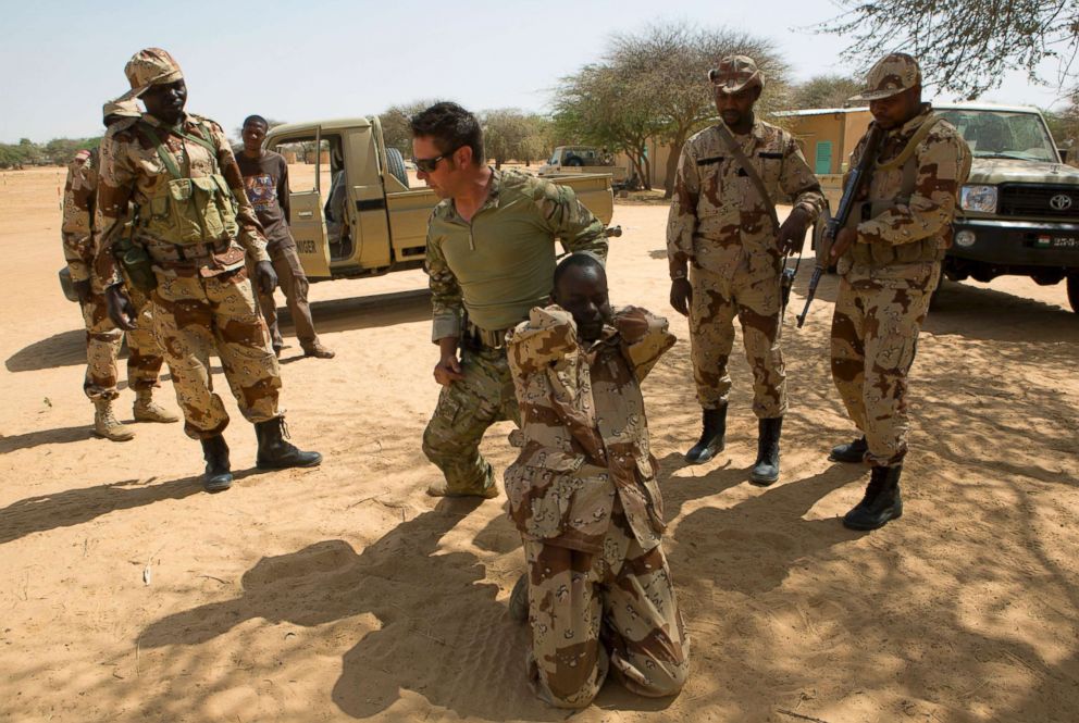 PHOTO: A U.S. special forces soldier demonstrates how to detain a suspect during a U.S.-led international training mission for African militaries, in Diffa, Niger, March 4, 2014. 