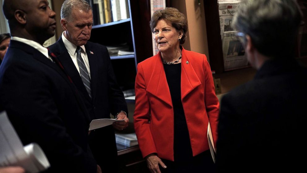 PHOTO: Sen. Jeanne Shaheen (D-NH) (R) talks to Sen. Thom Tillis (R-NC) (2nd L) and Sen. Tim Scott (R-SC) (L) prior to a news conference at the Capitol, Feb. 7, 2018. 
