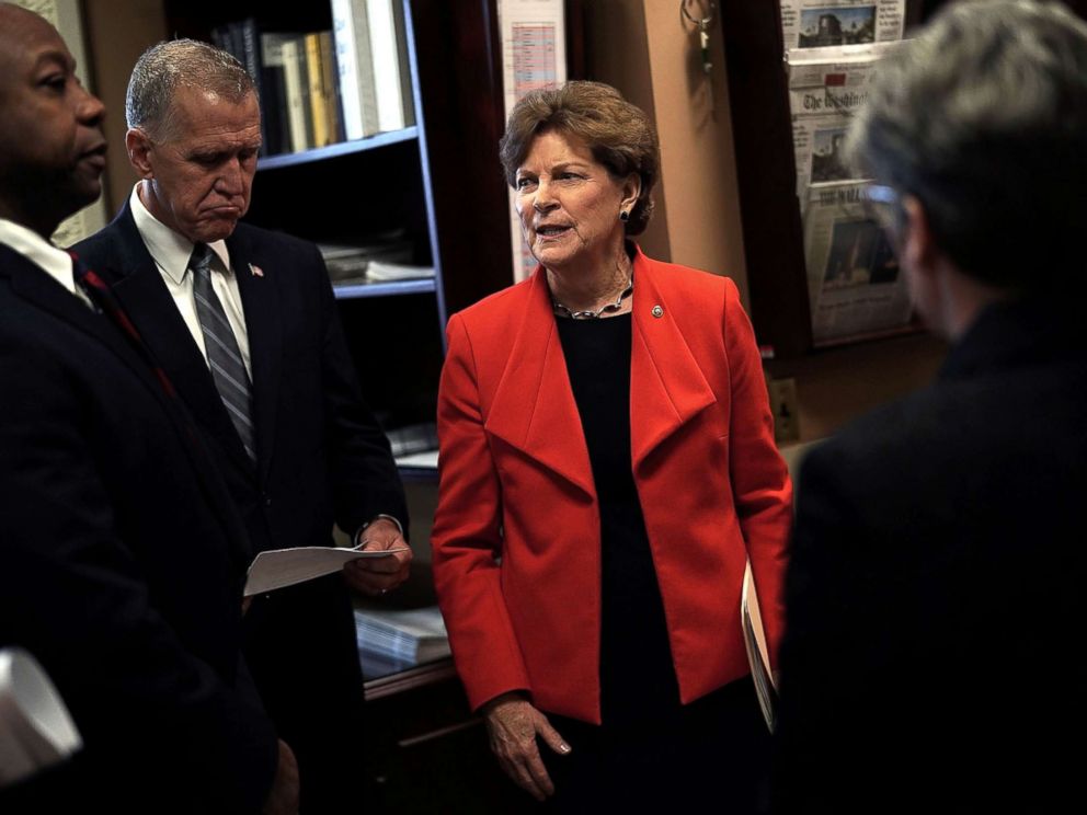   PHOTO: Senator Jeanne Shaheen (D-NH) (R) meets with Senator Thom Tillis (R-NC) (2nd L) and Senator Tim Scott (R-SC) (L) before a press conference on Capitol Hill, February 7, 2018. 