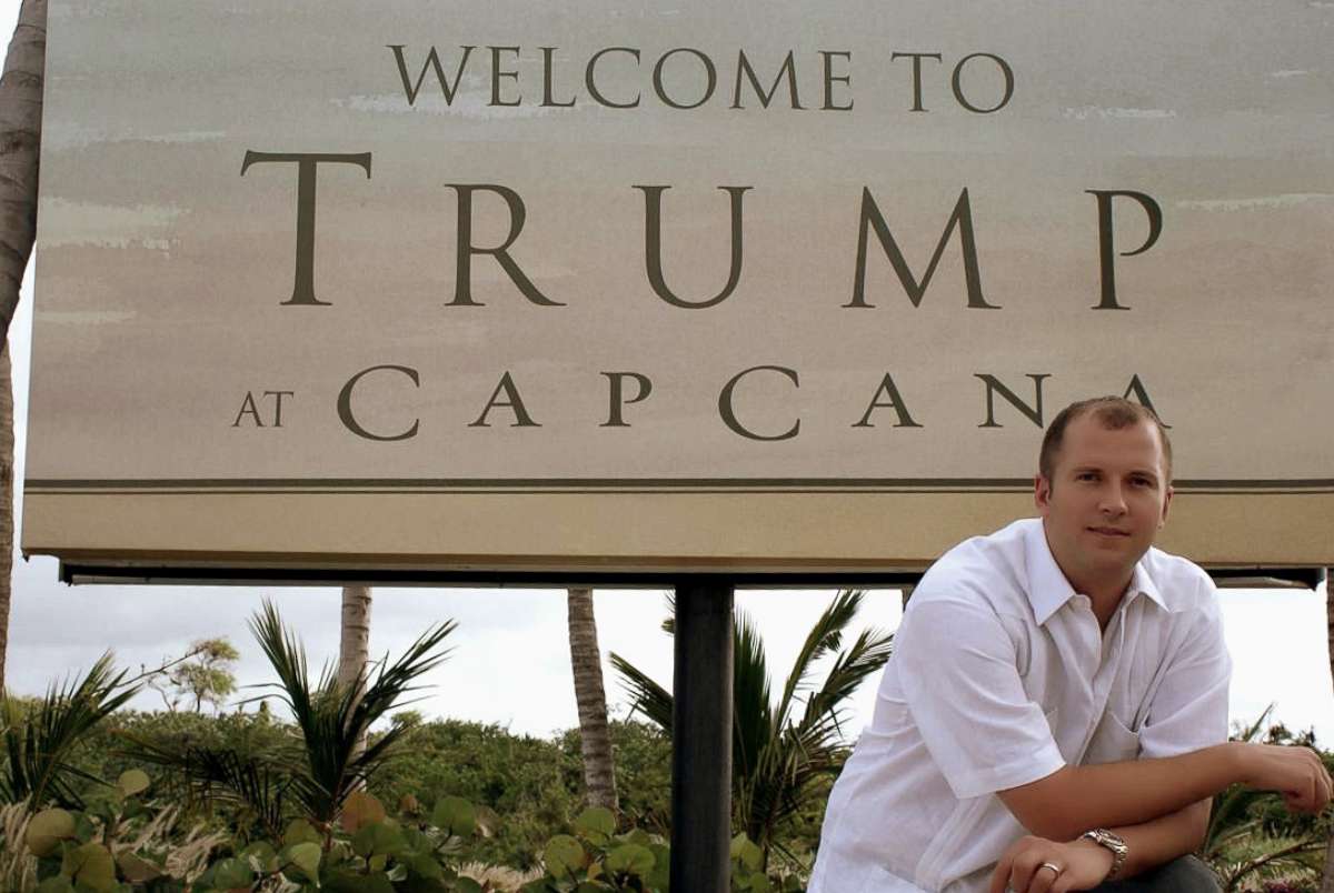PHOTO: William Ganz poses in front of a sign for the original Trump Cap Cana development.