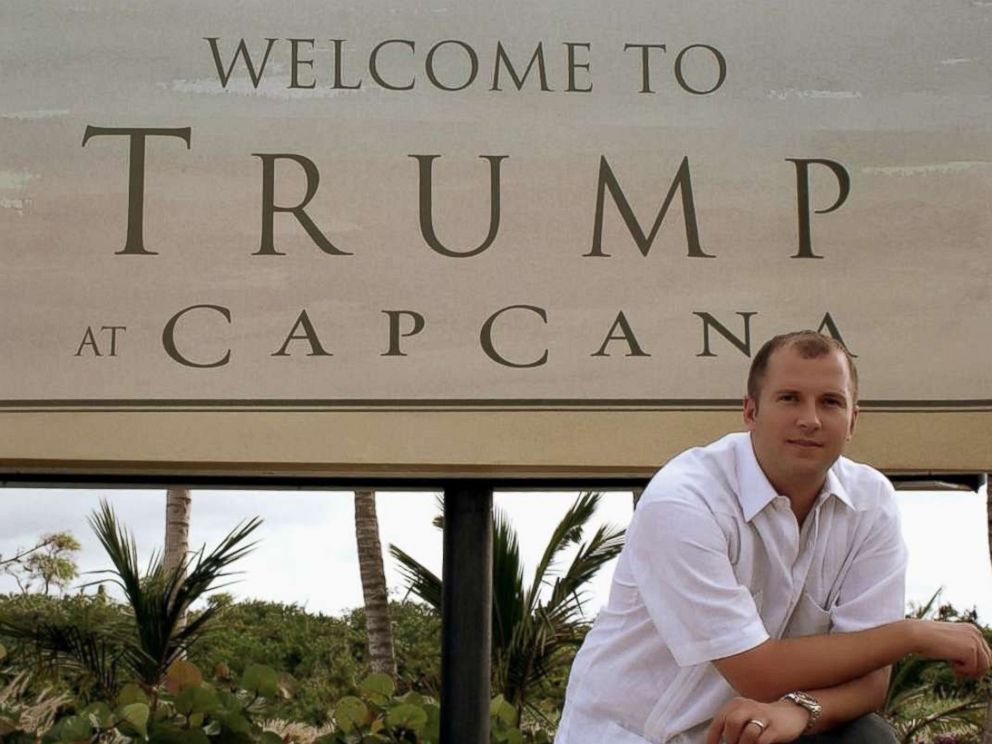 PHOTO: William Ganz poses in front of a sign for the original Trump Cap Cana development.