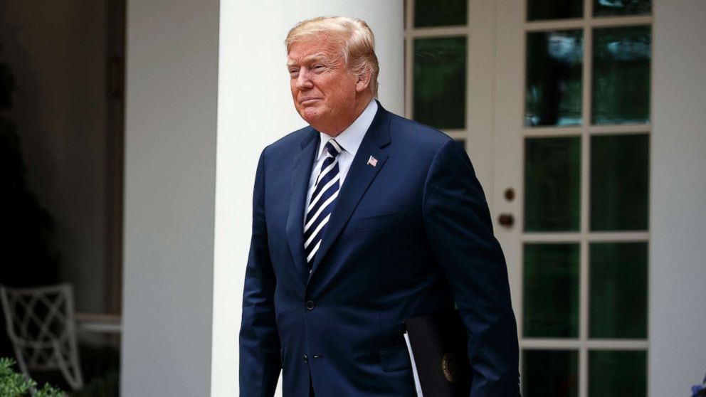 President Donald Trump walks to the Rose Garden of the White House, June 6, 2018.