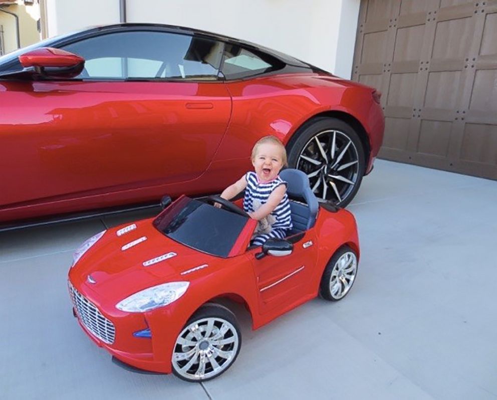 PHOTO: Laura Schwab's daughter Marie in her own mini Aston Martin.