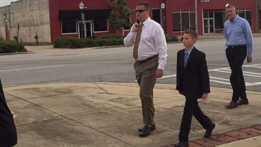PHOTO: Peter Hurley and his son, Jake, walk to the courthouse in Albany, Georgia, Sept. 21, 2015. Jake Hurley was poisoned with Salmonella in 2009 through peanut products from the Peanut Corporation of America.