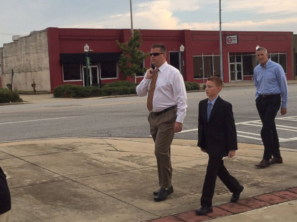 PHOTO: Peter Hurley and his son, Jake, walk to the courthouse in Albany, Georgia, Sept. 21, 2015. Jake Hurley was poisoned with Salmonella in 2009 through peanut products from the Peanut Corporation of America.