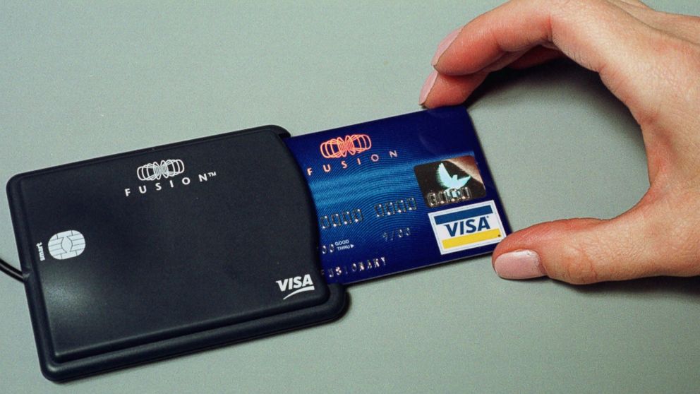 PHOTO: A credit card is inserted into a smart card reader at a public relations firm in Cambridge, Mass. on Dec. 7, 2000. 