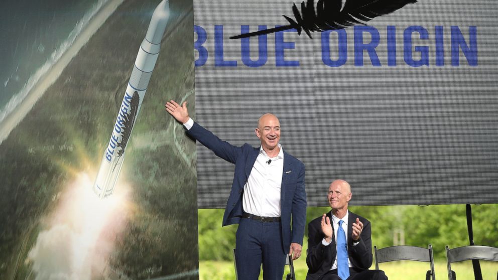 PHOTO: Amazon CEO Jeff Bezos, left, unveils the new Blue Origin rocket, as Florida Gov. Rick Scott, right, applauds during a news conference at the Cape Canaveral Air Force Station in Cape Canaveral, Fla., Sept. 15, 2015.