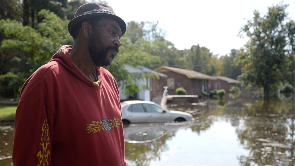 PHOTO: William Murrell stands at the edge of his property, which is partially underwater, due to Hurricane Matthew, on Cedar Lane in Kinston, N.C. , Friday, Oct. 14, 2016.