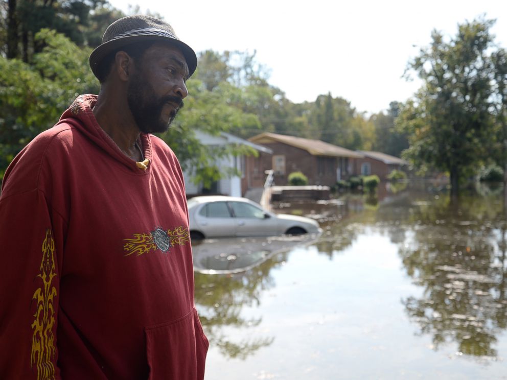 PHOTO: William Murrell stands at the edge of his property, which is partially underwater, due to Hurricane Matthew, on Cedar Lane in Kinston, N.C. , Friday, Oct. 14, 2016.