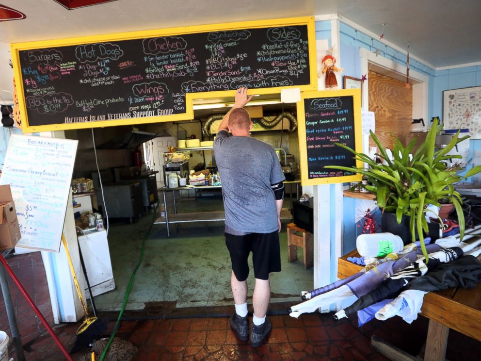 PHOTO: Tim Carter pauses as he looks over the flood damaged kitchen, Oct. 13, 2016, at the restaurant that he and his wife Trina run on Hatteras Island, N.C. Storm surge and heavy rains from Hurricane Matthew flooded both their restaurant and their home.