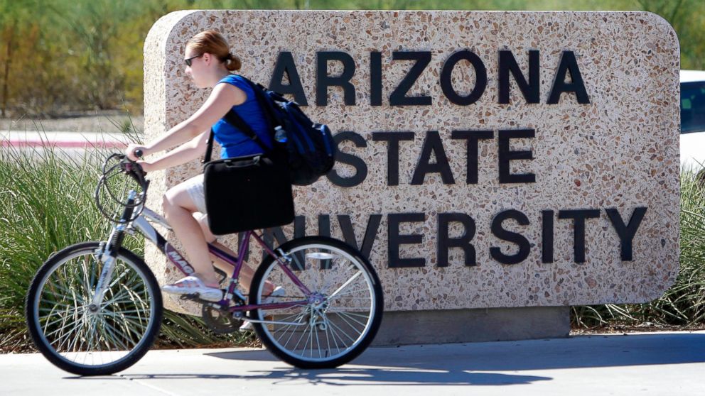 PHOTO: A student rides through the Arizona State University campus, Sept. 23, 2010, in Tempe, Ariz.