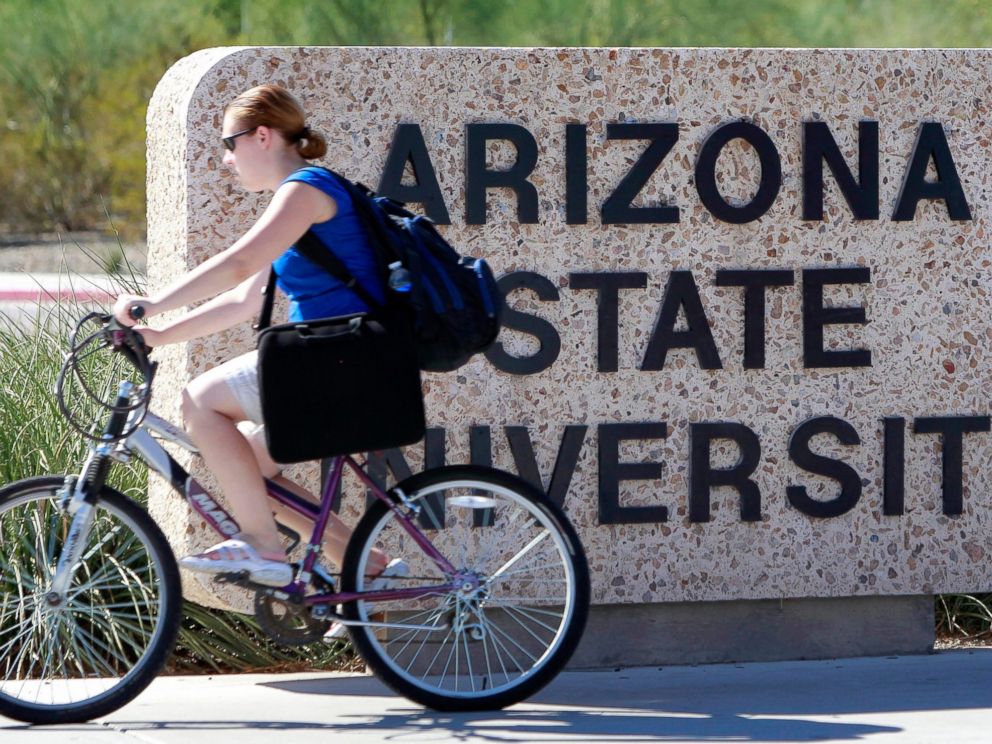 PHOTO: A student rides through the Arizona State University campus, Sept. 23, 2010, in Tempe, Ariz.